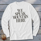 White long-sleeve shirt with bold dark text that reads "WE SPEAK MOUNTAIN HERE".