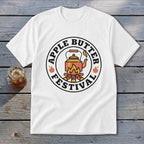 White t-shirt with circular "Apple Butter Festival" graphic featuring a kettle over a campfire.