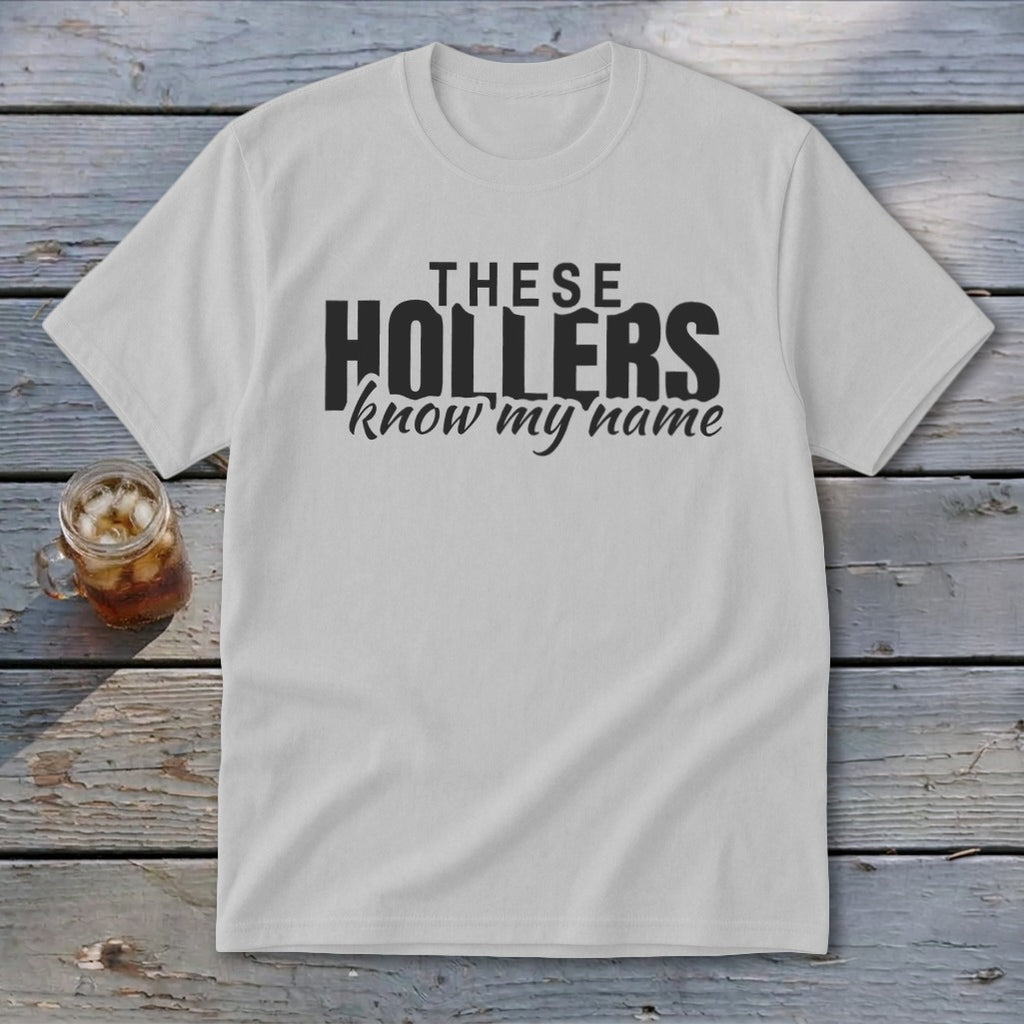 White t-shirt with black text that reads "THESE HOLLERS know my name".