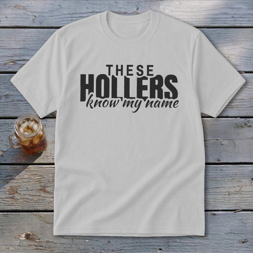 White t-shirt with black text that reads "THESE HOLLERS know my name".