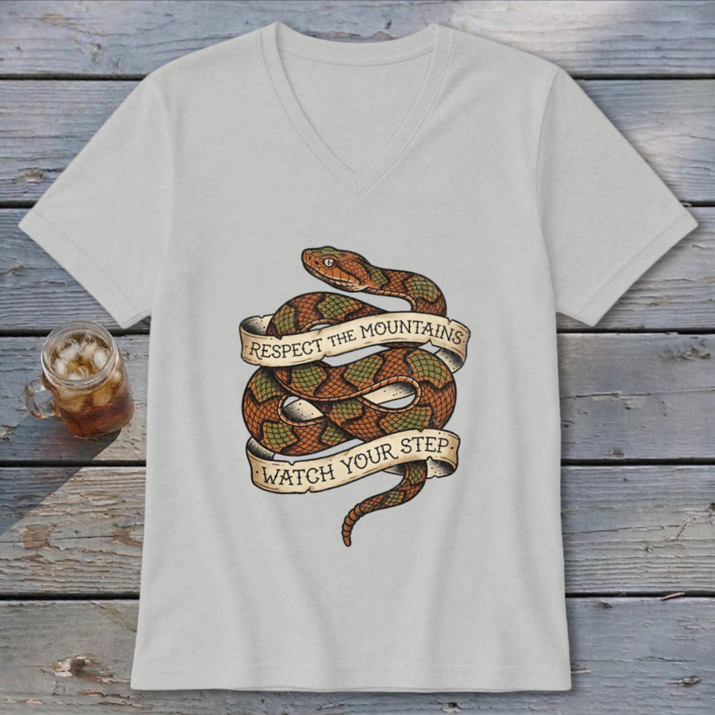 Light grey v-neck t-shirt with coiled snake graphic and text "Respect the Mountains Watch Your Step".