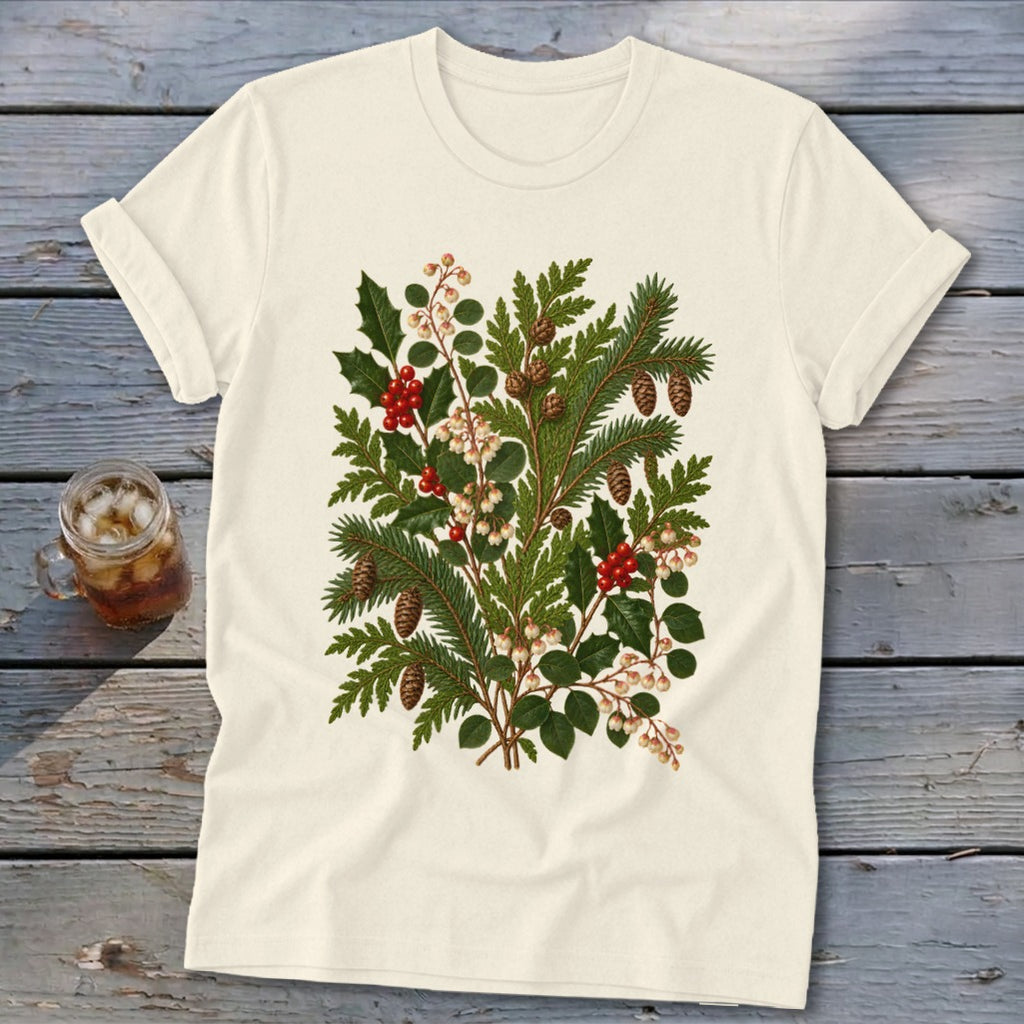 Cream t-shirt with a vintage botanical illustration of pine, holly, berries, and pinecones.