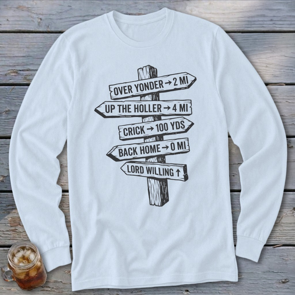 A white long-sleeved t-shirt features a black graphic of a wooden signpost with directional distance text.