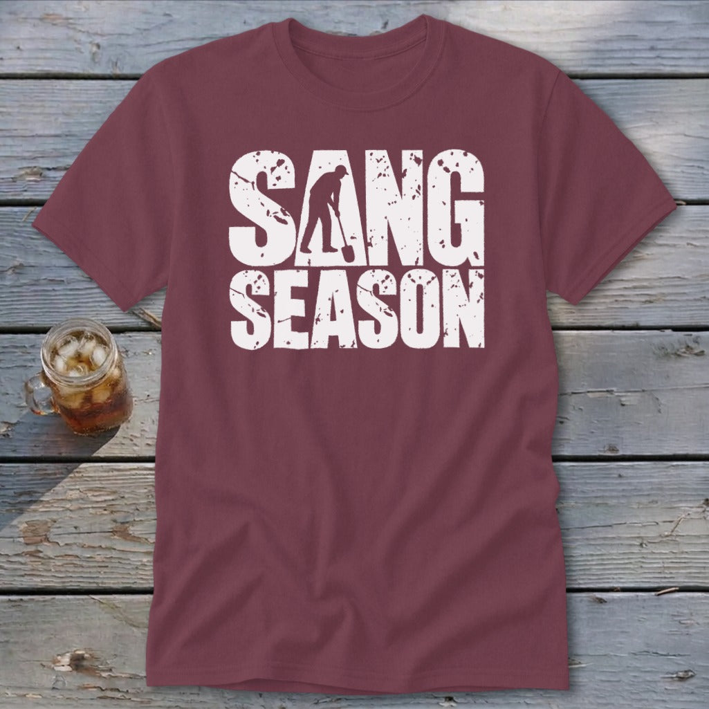 A maroon t-shirt with white distressed text reading "SANG SEASON" and a digger graphic.