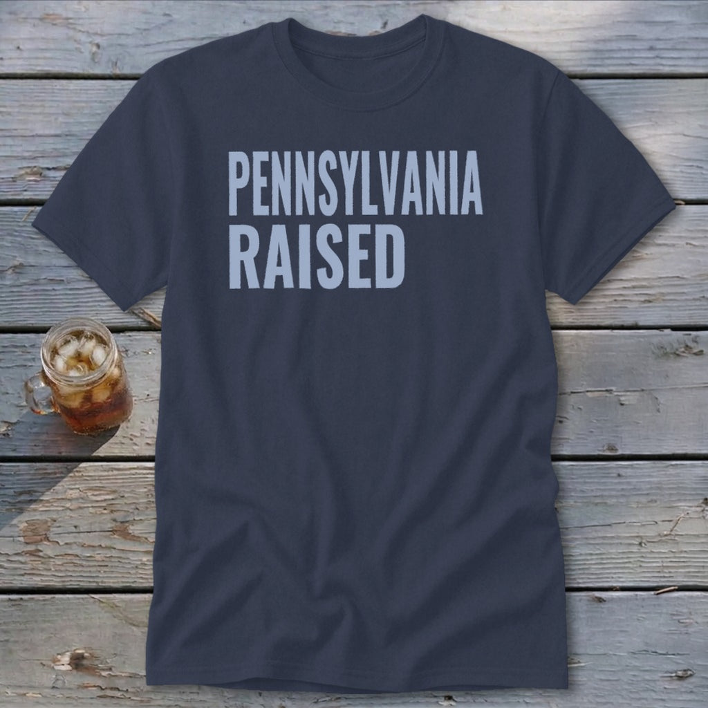 Dark navy t-shirt with "PENNSYLVANIA RAISED" printed in light blue.