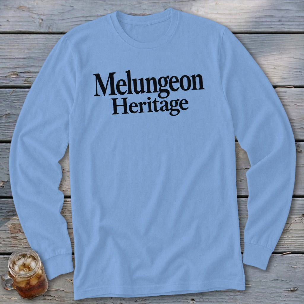 Light blue long-sleeve t-shirt with Melungeon Heritage printed in black across the chest.