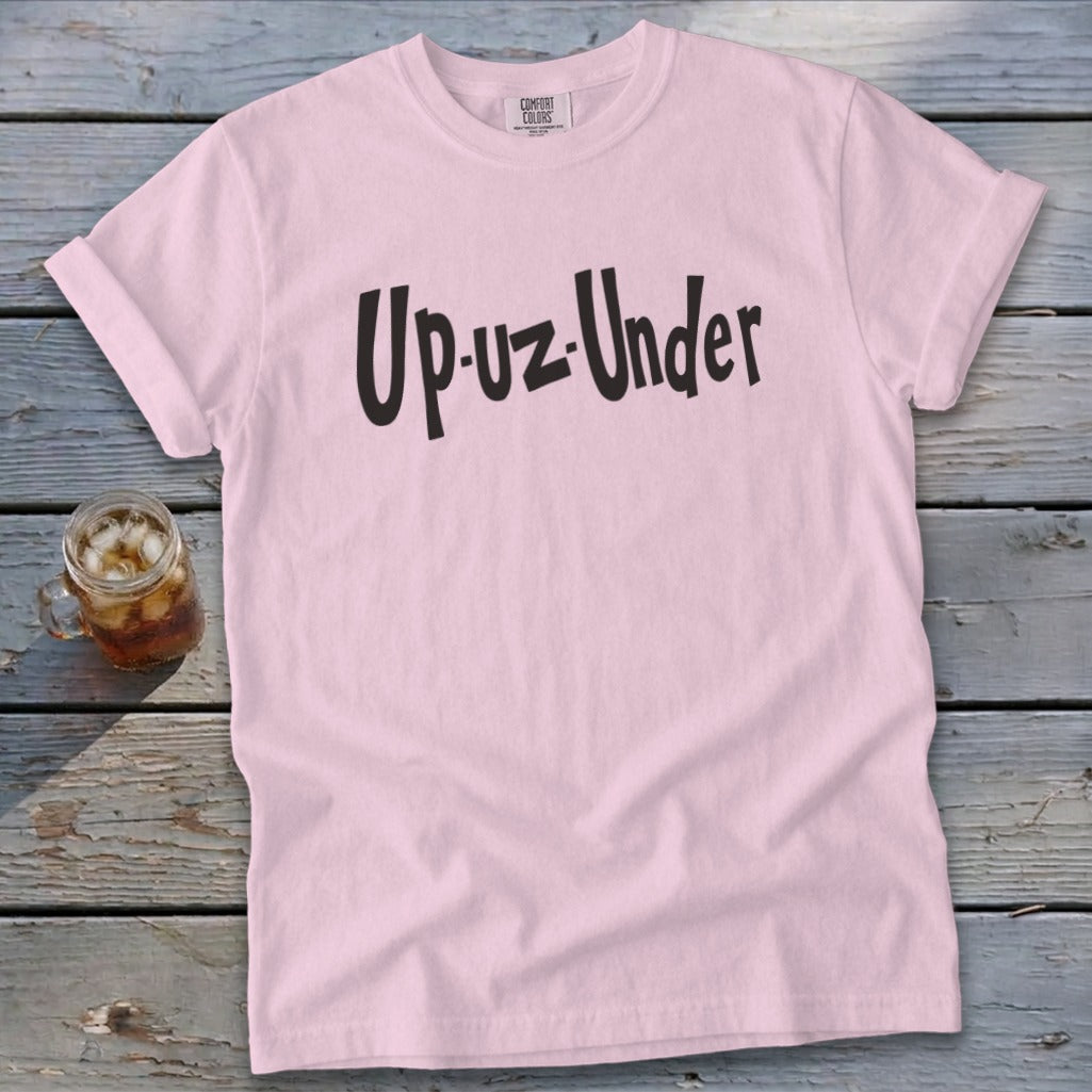 Pink t-shirt with "Up-uz-Under" text and a glass of iced tea.
