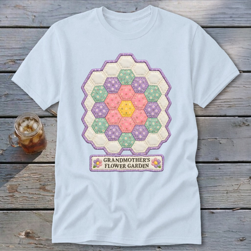 Light blue t-shirt with a hexagon quilt design and "Grandmother's Flower Garden" text.
