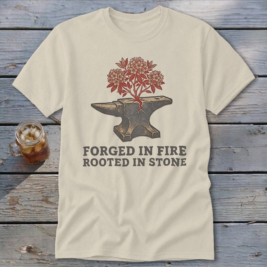 Anvil with blooming tree and text "FORGED IN FIRE ROOTED IN STONE".