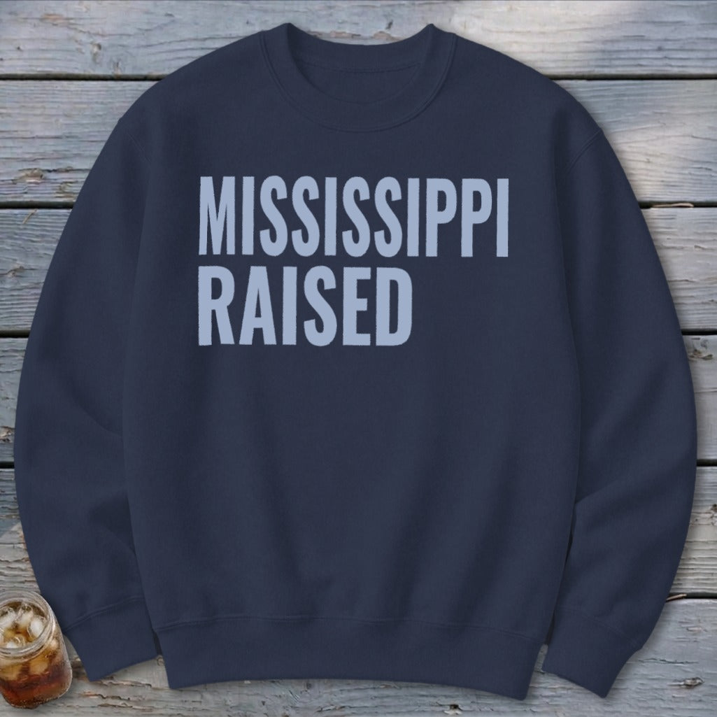 Navy sweatshirt with "MISSISSIPPI RAISED" text in light blue.