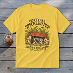 Yellow t-shirt with speckled pup graphic under a red wagon.