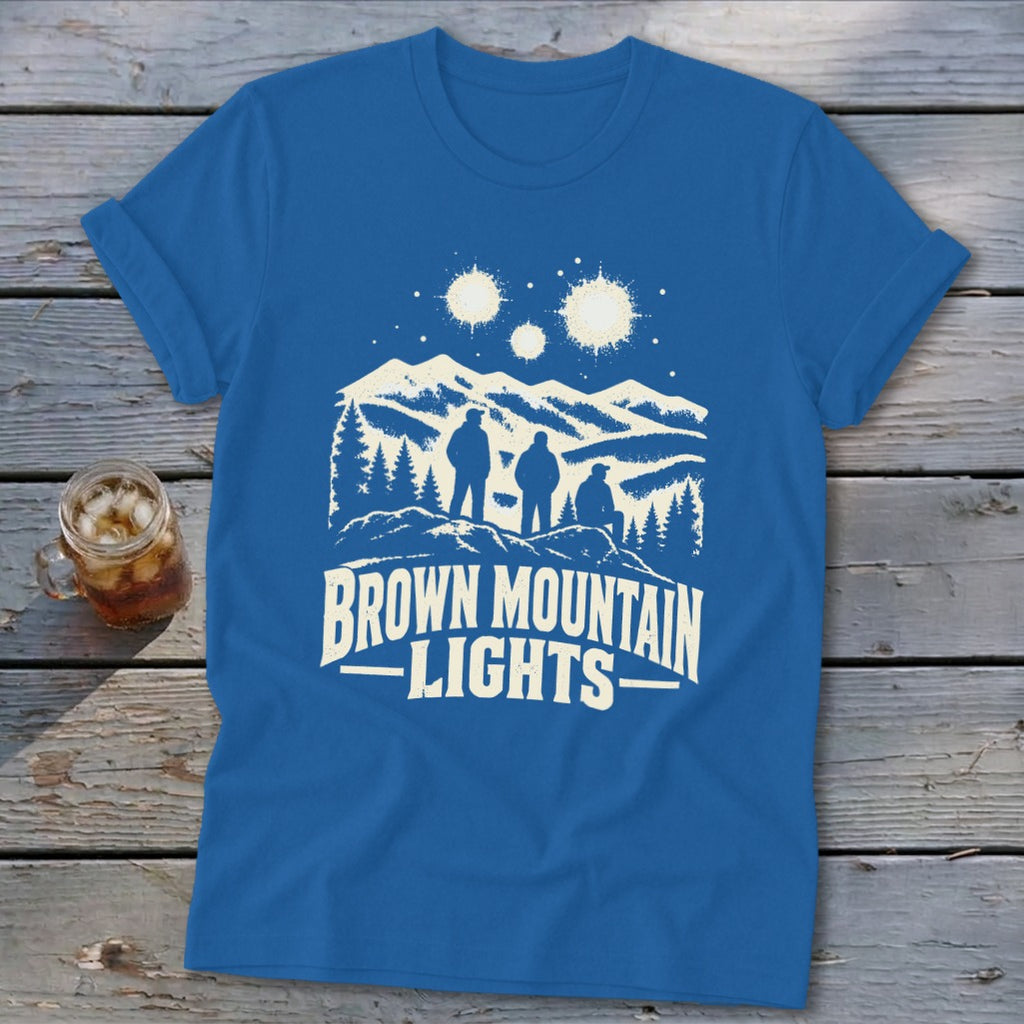 Royal blue t-shirt featuring a mountain graphic with three figures and text reading Brown Mountain Lights.