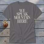 Grey t-shirt with "We Speak Mountain Here" text in cream font.