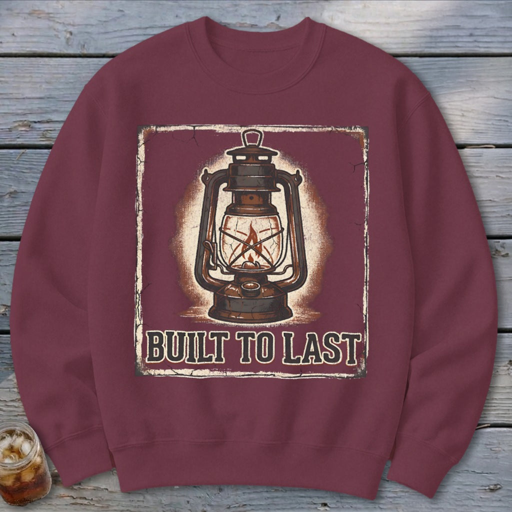 Maroon sweatshirt with a vintage lantern graphic and "BUILT TO LAST" text.