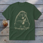 Dark green t-shirt with illustration of bear carving wood with a knife.