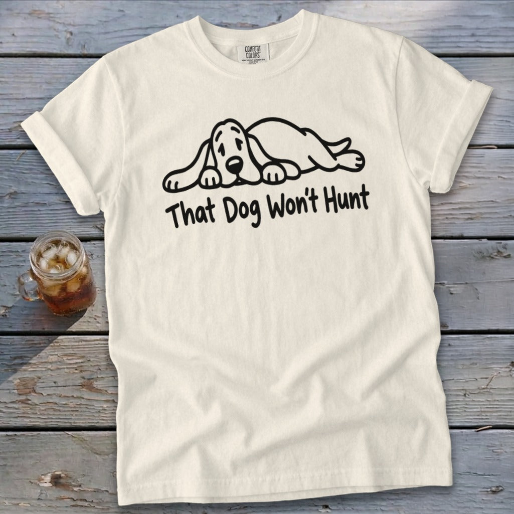 Off-white t-shirt with a black graphic of a sleeping dog and the text "That Dog Won't Hunt."