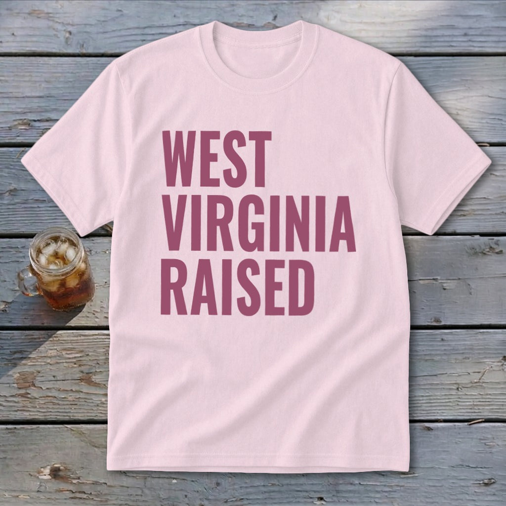 Pink t-shirt with "WEST VIRGINIA RAISED" text in maroon.