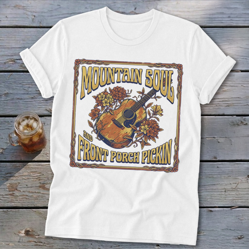 White t-shirt with "Mountain Soul and Front Porch Pickin'" text and guitar graphic.