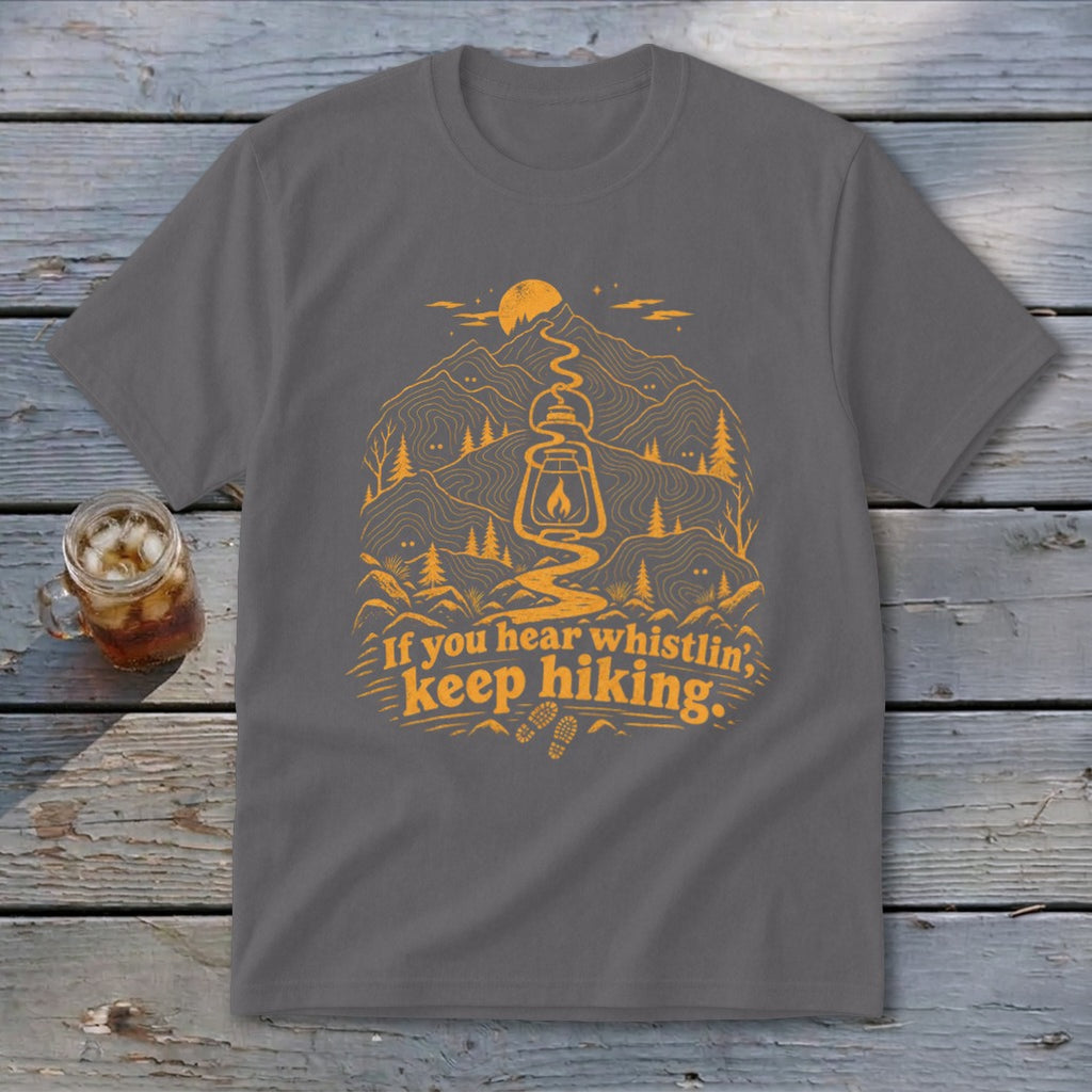 Grey t-shirt with orange mountain, lantern, and hiking graphic and text.