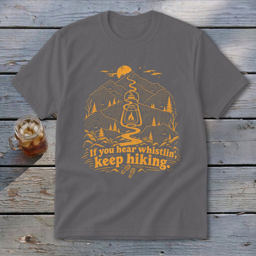 Grey t-shirt with orange mountain, lantern, and hiking graphic and text.