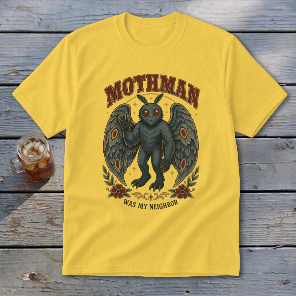 Yellow t-shirt with Mothman graphic and text "Mothman Was My Neighbor."