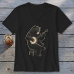 Black v-neck t-shirt with a bear playing a banjo on a stool.