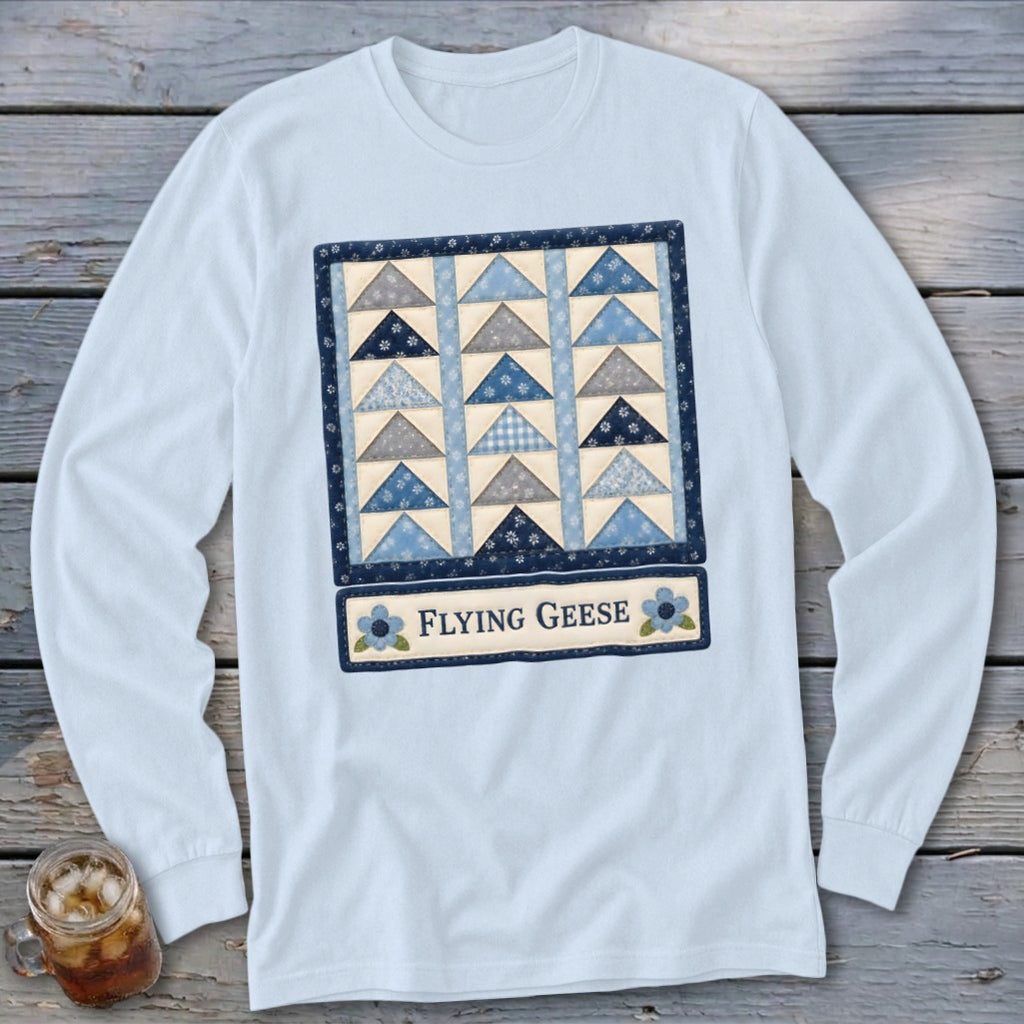 Light blue long-sleeve shirt with a "Flying Geese" quilt pattern graphic.