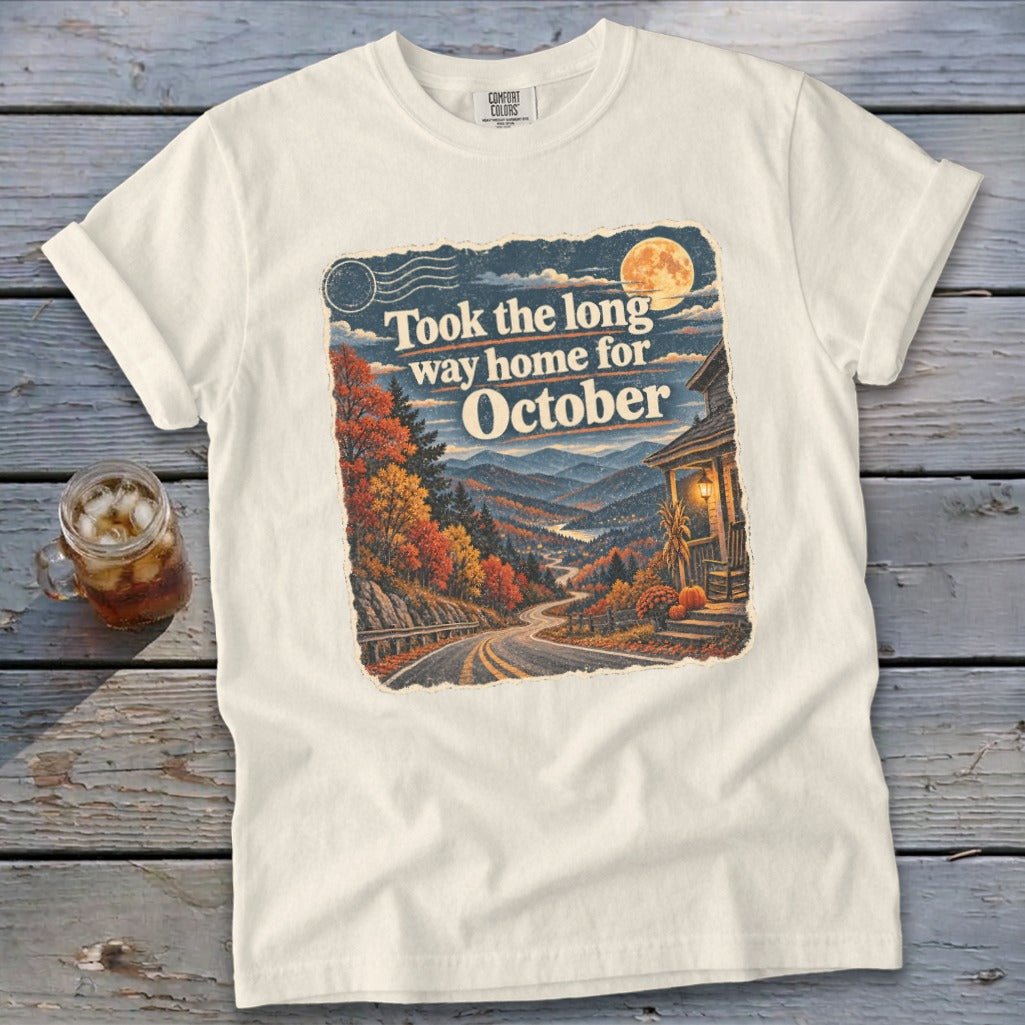 Cream t-shirt with vintage-style graphic: "Took the long way home for October."