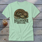 Hellbender salamander graphic with "Hellbender Holler" text on a light green t-shirt.