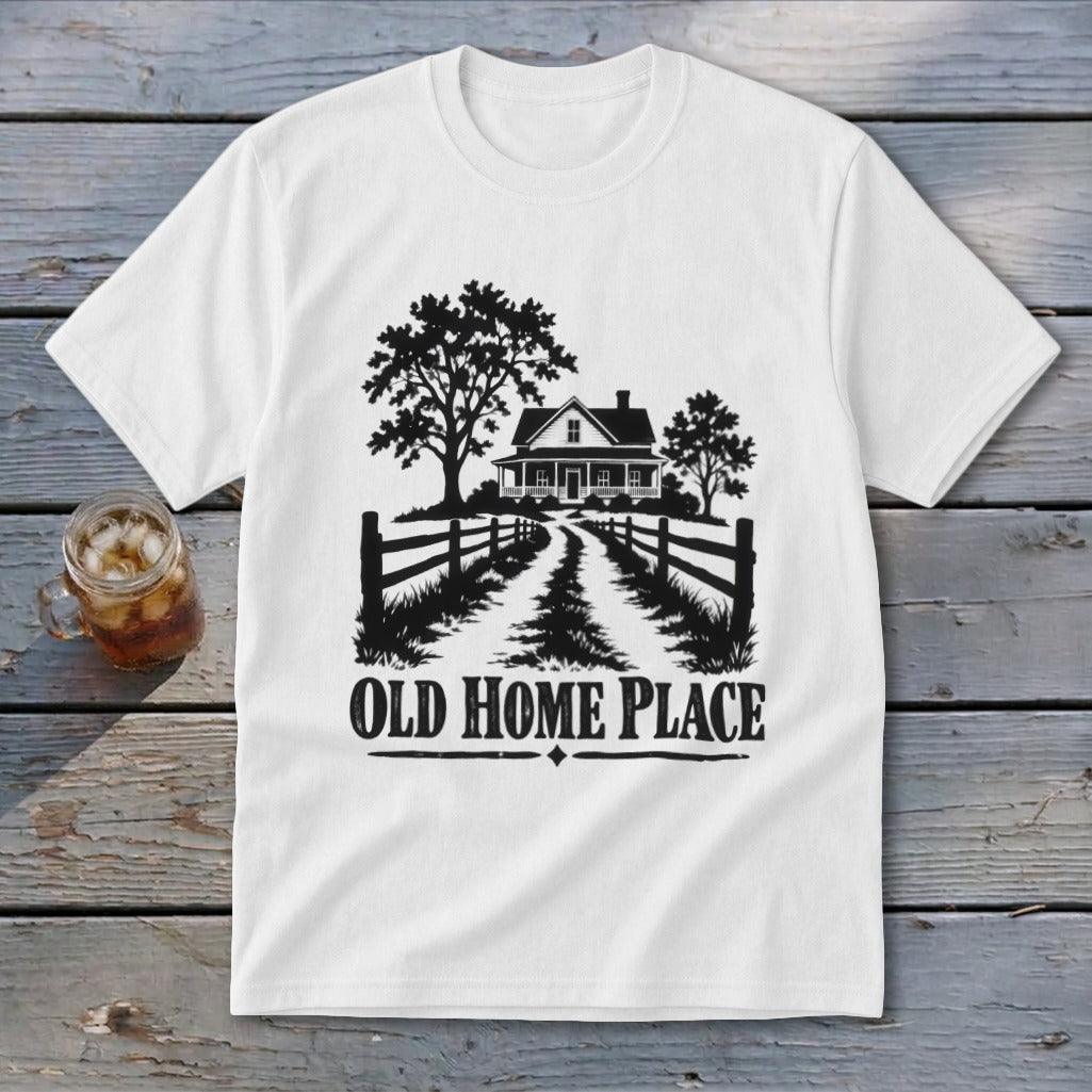 White t-shirt with a graphic of a farmhouse, trees, fence, and text "OLD HOME PLACE".