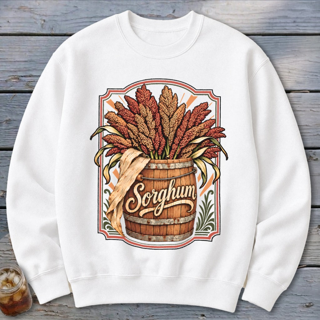White sweatshirt featuring a graphic of sorghum stalks in a wooden barrel with the word "Sorghum".