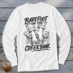 White long-sleeve shirt with black graphic of bare feet on a rock in water, text reads "Barefoot on the Creek Bank".