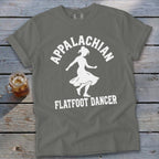 A grey t-shirt featuring a white silhouette of a dancer and the text Appalachian Flatfoot Dancer.