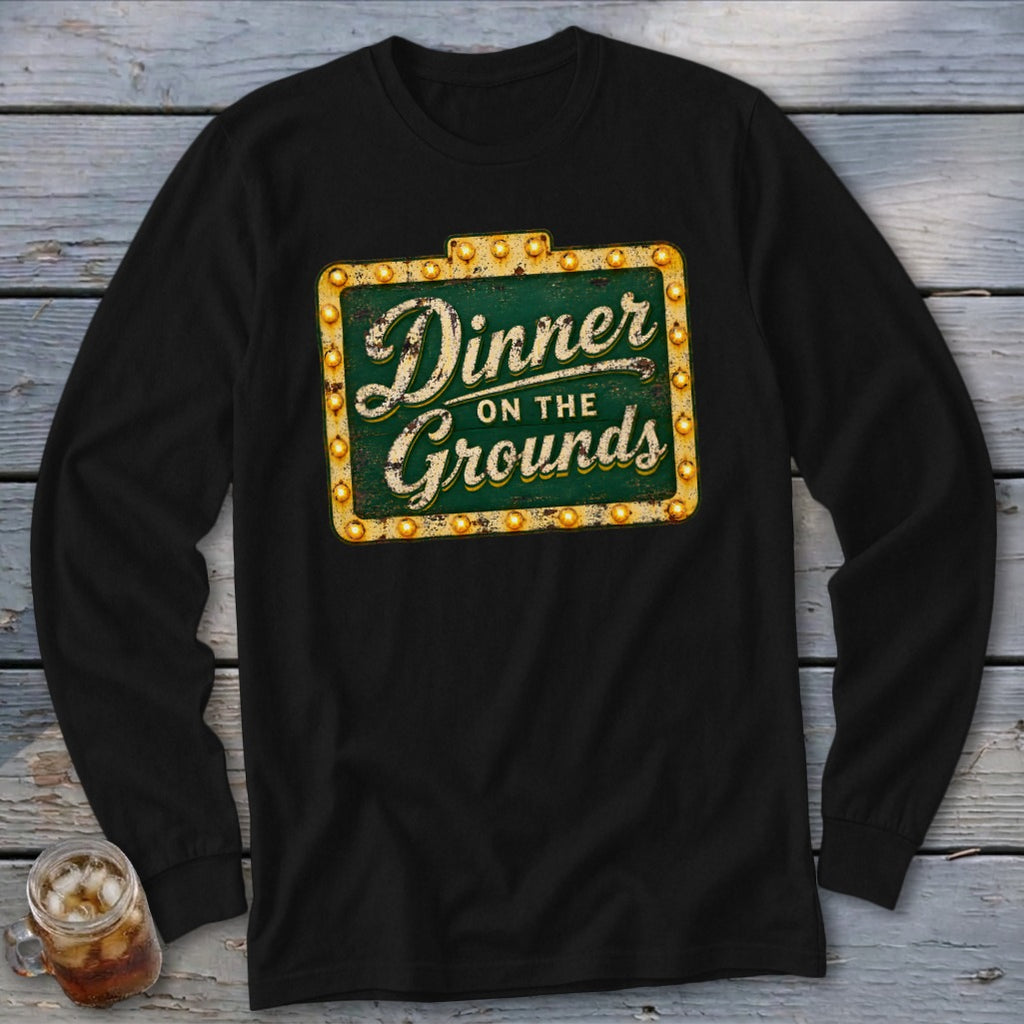 Black long-sleeve t-shirt with a vintage-style green sign graphic reading Dinner on the Grounds.