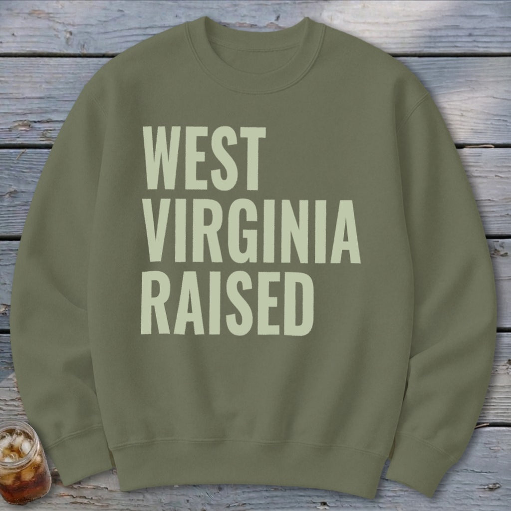Olive green sweatshirt with "WEST VIRGINIA RAISED" text in light beige.