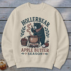 Bear wearing bandana stirring pot of apple butter, text reads Hollerbear Apple Butter Season.