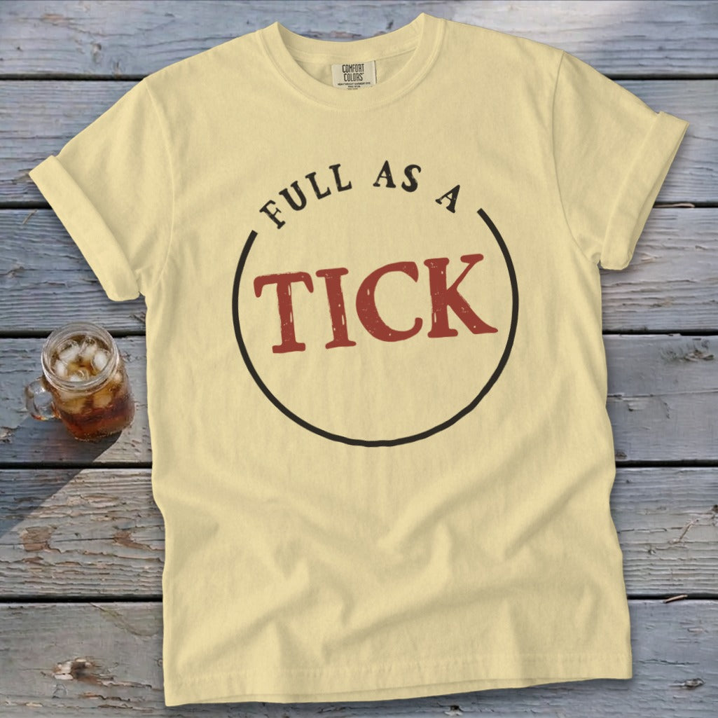 Light yellow t-shirt with "FULL AS A TICK" text inside a circle.