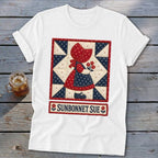 White t-shirt featuring a Sunbonnet Sue quilt design with flowers and text.