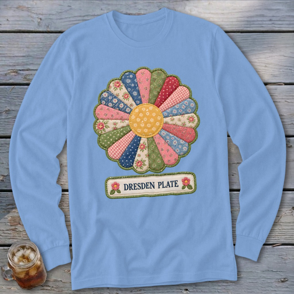 Light blue long-sleeve shirt with a colorful quilted Dresden Plate flower design and text.