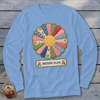 Light blue long-sleeve shirt with a colorful quilted Dresden Plate flower design and text.
