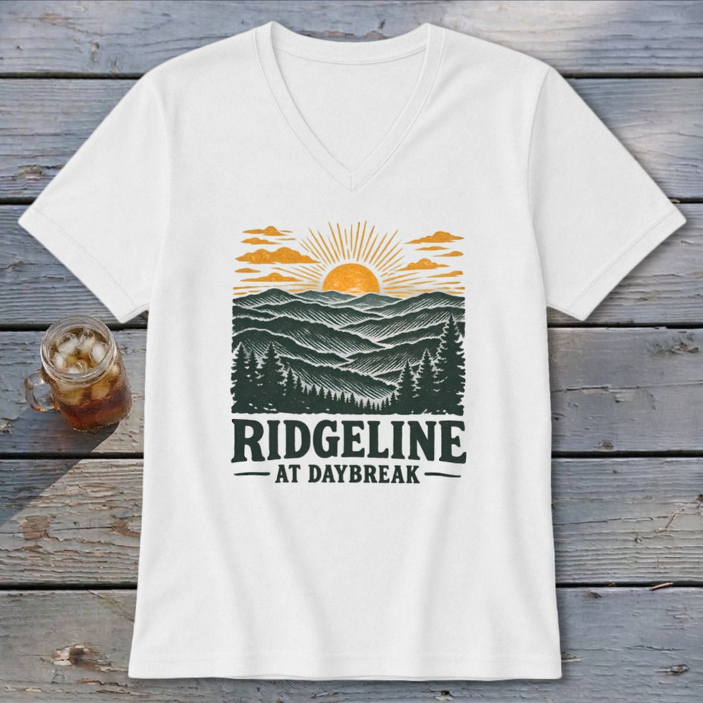 White t-shirt with "RIDGELINE AT DAYBREAK" text and mountain landscape graphic.