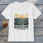 White t-shirt with "RIDGELINE AT DAYBREAK" text and mountain landscape graphic.