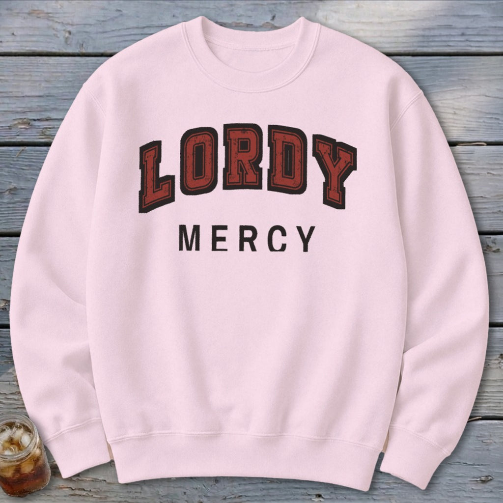 Light pink sweatshirt with "LORDY MERCY" text in dark red and black lettering.