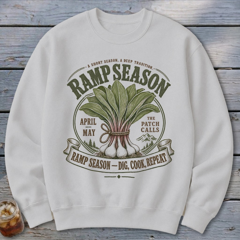 White sweatshirt with "Ramp Season" graphic, featuring ramps, text, and mountains.