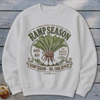 White sweatshirt with "Ramp Season" graphic, featuring ramps, text, and mountains.