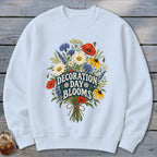Light blue sweatshirt with a floral graphic and "Decoration Day Blooms" text.