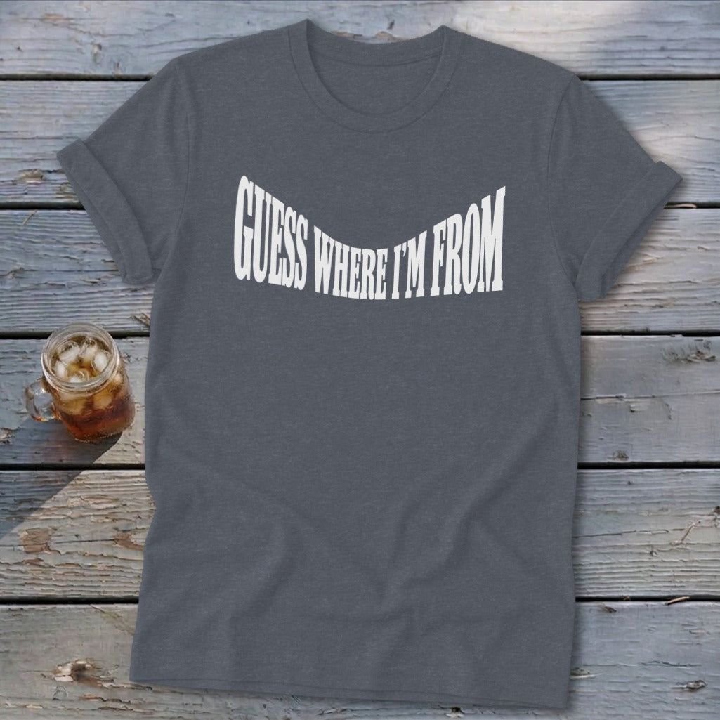 Grey t-shirt with white text that reads "GUESS WHERE I'M FROM".