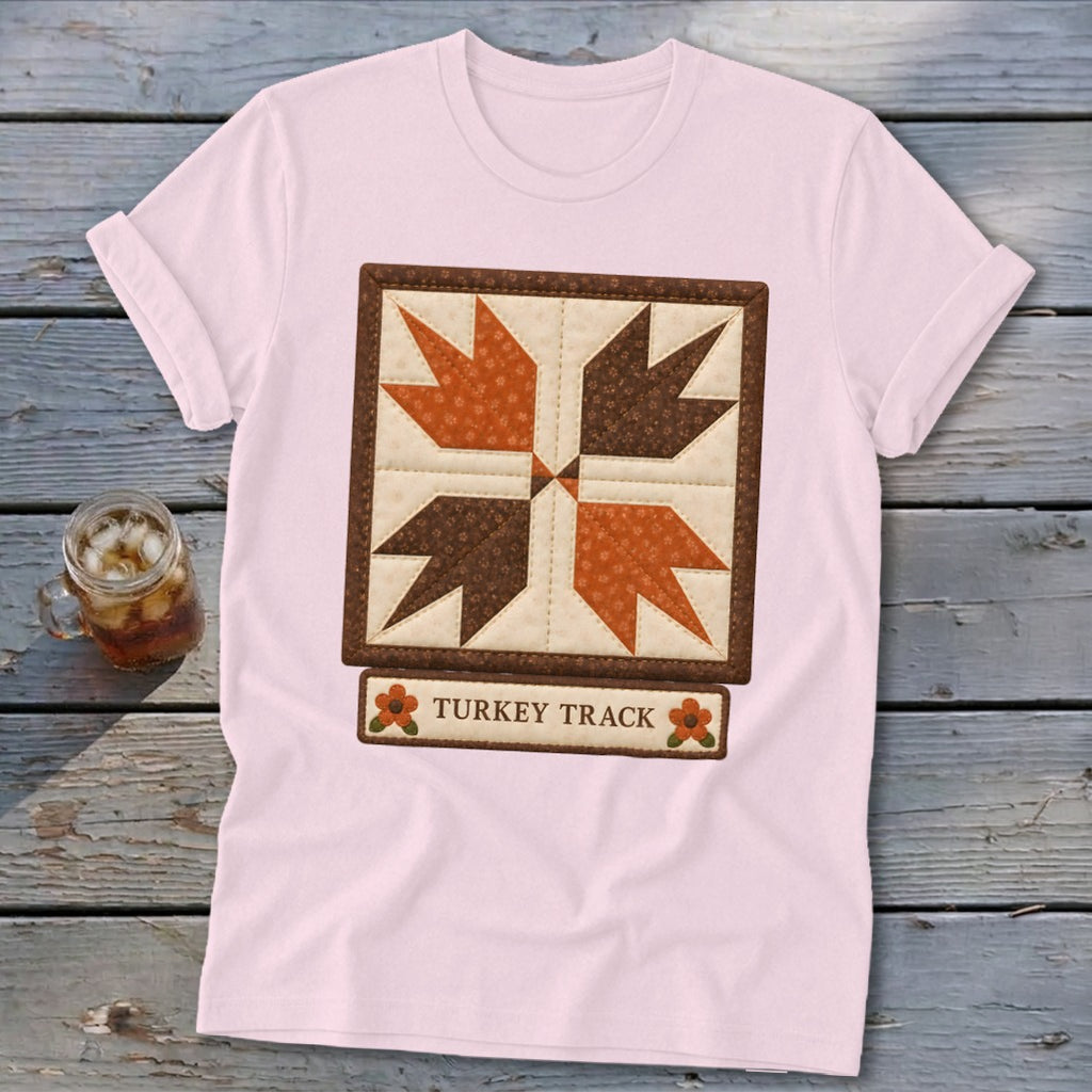 Pink t-shirt with a "Turkey Track" quilt block design and text.