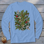 Light blue long-sleeve shirt with a central holiday botanical illustration featuring pine, holly, berries, and pinecones.