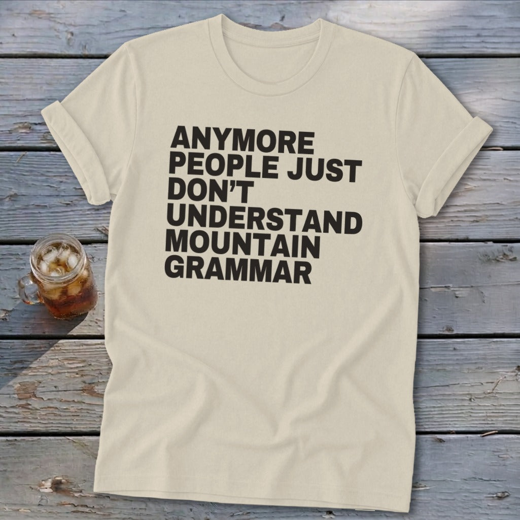 Cream t-shirt with black text "Anymore people just don't understand mountain grammar".